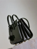 Green patent leather handbag from the Sac De Jour collection