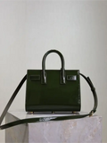 Green patent leather handbag from the Sac De Jour collection