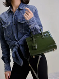 Green patent leather handbag from the Sac De Jour collection