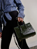 Green patent leather handbag from the Sac De Jour collection