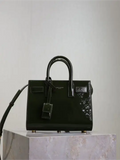 Green patent leather handbag from the Sac De Jour collection